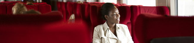 A woman relaxing onboard a Thalys train to Amsterdam